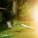 Lawn chairs and lounge on green grass near house