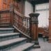 a staircase in a large room with wooden paneling