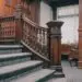 a staircase in a large room with wooden paneling
